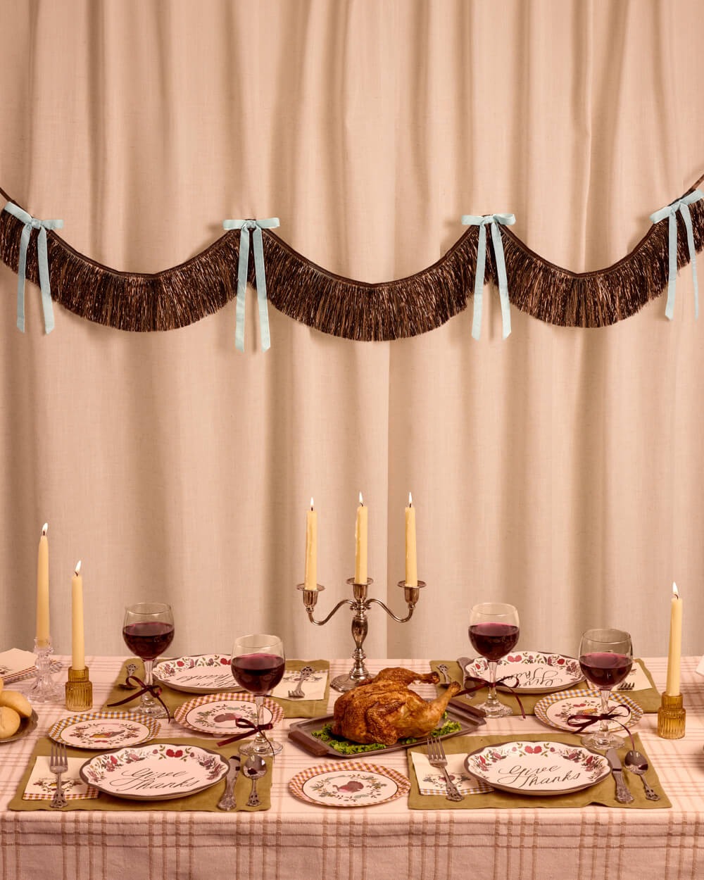Brown Fringe Backdrop with Blue Velvet Bows
