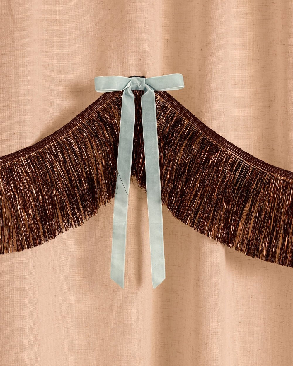 Brown Fringe Backdrop with Blue Velvet Bows