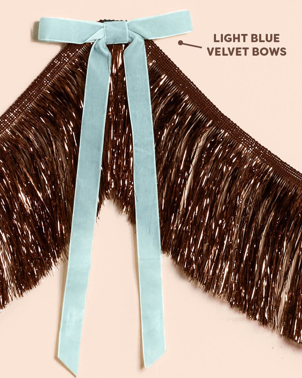 Brown Fringe Backdrop with Blue Velvet Bows